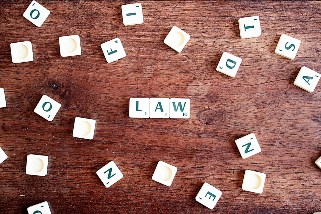 the word "law" spelled out in scrabble tiles