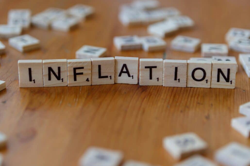 scrabble tiles that spell out the word "inflation"