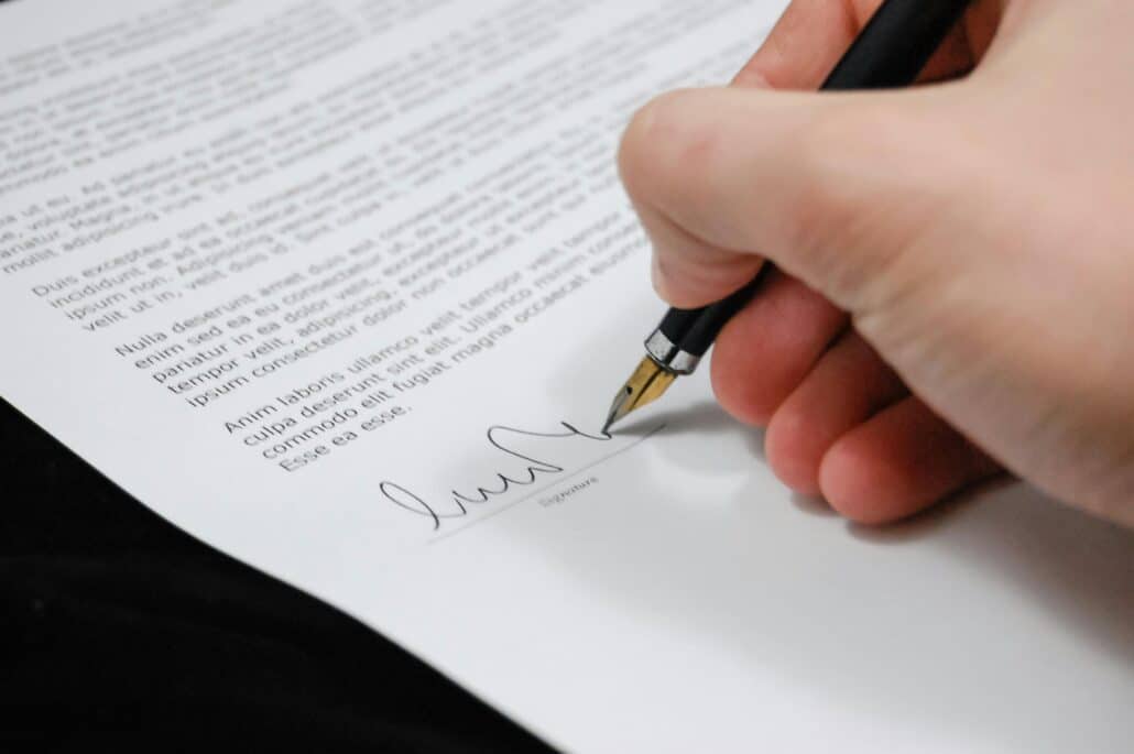 someone signing a legal document